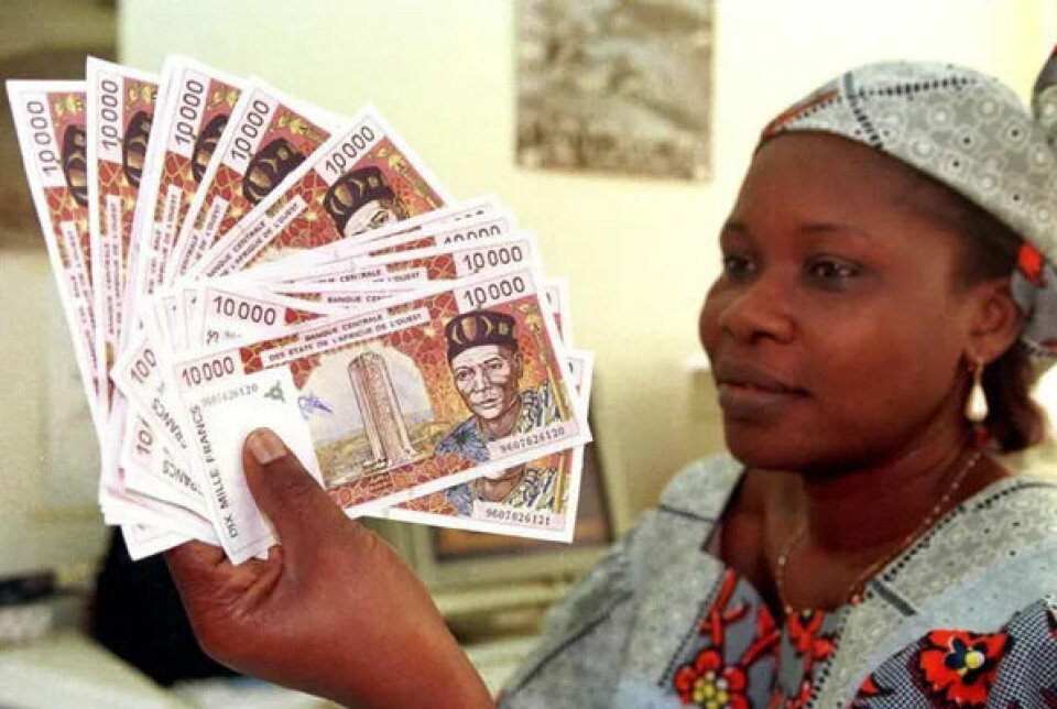 A woman displays several 10,000 CFA (African Financial Community) franc banknotes in Abidjan, on April 10, 1999.
Photo by Issouf Sanogo/AFP via Getty Images A woman displays several 10,000 CFA (African Financial Community) franc banknotes in Abidjan, on April 10, 1999.
Photo by Issouf Sanogo/AFP via Getty Images