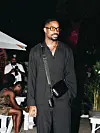 Oscar Eche wearing black lagos fashion week