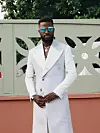 Akin Faminu white suit
