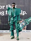 Green suit in front of green shoes