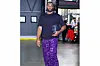 Precious Achiuwa wears a plain deep purple shirt over purple pants streaked with characters.