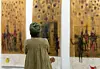 A woman looks at an artwork at the 2022 Investec Cape Town Art Fair.