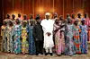 A photo of President Muhammadu Buhari and Vice President Yemi Osinbajo with the 21 Chibok schoolgirls released in 2016.