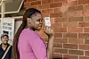 ​A young woman holds her identity card after she registered as a voter for the first time, ahead of the 2024 South African general elections, in the Verulam township, near Durban, on February 03, 2024.