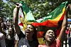 Women holding a flag of Zimbabwe take part in a demonstration of University of Zimbabwe's students, on November 20, 2017 in Harare, to demand the withdrawal of Grace Mugabe's doctorate and refused to sit their exams as pressure builds on Zimbabwe's President Robert Mugabe to resign.