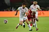 Madagascar's Lalaina Nomenjanahary (C) and Tunisia's Oussama Haddadi (L) battle for the ball during the 2019 Africa Cup of Nations quarter final soccer match between Madagascar and Tunisia at the Al-Salam Stadium.