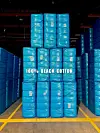 100% Black Cotton Bales of Black-owned cotton harvested from a farm operating since 1877 in Alabama, symbolizing resilience and heritage in textile production.