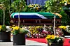 A coffin wrapped in a South African flag.