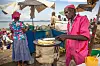 The image shows a 'Rolex' merchant frying chapatis. Rolex in Uganda refers to a delicacy prepared in a few minutes , its made by frying eggs and then a chapati is wrapped around the egg and rolled. It is a very delicious treat, that has gained massive popularity over the years.