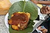 Waakye, Ghanaian food served in a leaf.