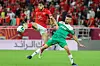 Ahly's midfielder Akram Tawfik (L) vies for the ball with Raja's forward Mahmoud Benhalib during the CAF Super Cup football match between Egypt's Al-Ahly and Morocco's Raja Club Athletic (Raja Casablanca) at the Ahmad Bin Ali Stadium in the Qatari city of Ar-Rayyan on December 22, 2021.