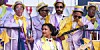 A still image from the film The Umbrella Men of minstrels in colorful outfits, waiting to play their instruments