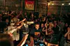 Ethiopian Records stands at the center of a lively crowd during a Boiler Room performance in Addis Ababa, smiling as people cheer and raise their hands around him.