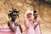 Three women all dressed in pink in a desert on-set for Sam Turpin's latest music video.