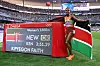 Gold medalist and new Olympic record holder Faith Kipyegon of Team Kenya poses for a photo in front of the scoreboard following the Women's 1500m Final on day fifteen of the Olympic Games Paris 2024 at Stade de France on August 10, 2024 in Paris, France.