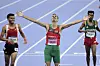 \u200bSoufiane El Bakkali (middle) of Team Morocco celebrates winning the gold medal in the Men's 3000m Steeplechase Final on day twelve of the Olympic Games Paris 2024 at Stade de France on August 07, 2024 in Paris, France.
