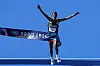 Tamirat Tola of Team Ethiopia crosses the finish line to win the Gold medal during the Men's Marathon on day fifteen of the Olympic Games Paris 2024 at Esplanade Des Invalides on August 10, 2024 in Paris, France.