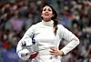 Nada Hafez of Team Egypt shows emotion after her victory against Elizabeth Tartakovsky of Team United States in the Fencing Women's Sabre Individual Table of 32 on day three of the Olympic Games Paris 2024 at Grand Palais on July 29, 2024 in Paris, France.