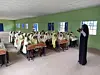 An image of \u200bRodiyah Omotoyosi Mikail, co-founder Book O'clock, addressing students