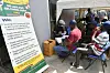 Men sit in a queue to test for HIV/AIDs in Lagos, Nigeria