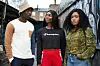 Michaela Coel and the cast of HBO's 'I May Destroy You' standing in a London alley. Wearing streetwear and bucket hat.