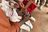 A health worker administers a malaria vaccine to a baby at a hospital in Soa, Cameroon, on January 22, 2024.