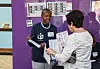 An IEC worker presents ballots to an elderly voter taking part in special early voting at the Reddam House Waterfall School on May 27, 2024 in Midrand, South Africa.