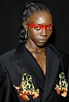 model wearing red eye makeup