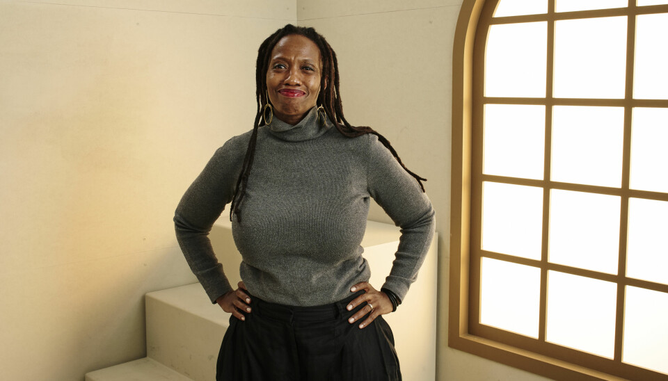 TORONTO, ONTARIO - SEPTEMBER 06: Zamo Mkhwanazi of 'Laundry' poses in the Getty Images Portrait Studio Presented by IMDb and IMDbPro during the Toronto International Film Festival at InterContinental Toronto Centre on September 06, 2025, in Toronto, Ontario. (Photo by Gareth Cattermole/Getty Images for IMDb) Zamo Mkhwanazi, director of ‘Laundry,’ poses for a photo wearing a dark gray turtleneck sweatshirt and black pants, smiling with arms on her hips