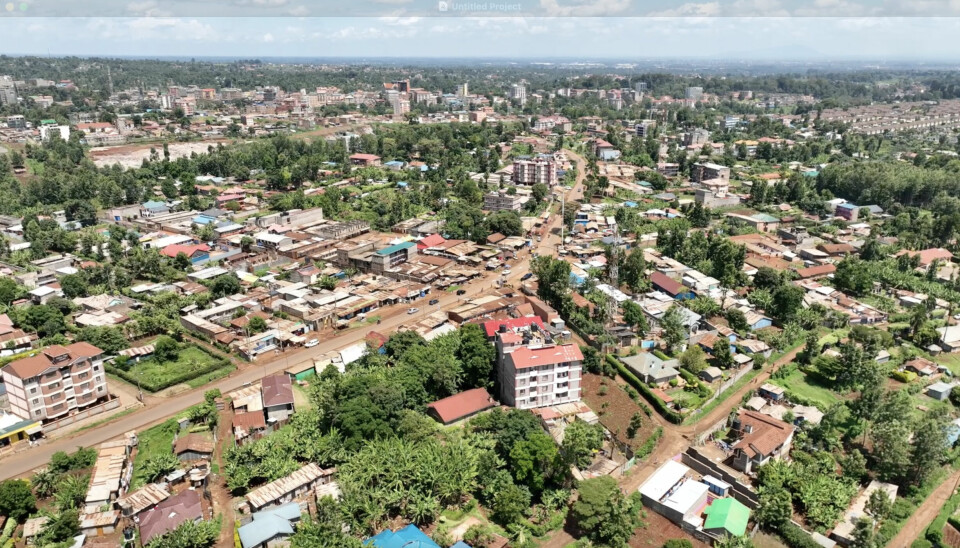 In Kiambu, just outside Nairobi, chef Geena Gichui has embraced independence and learned to create a home of her own. Aerial view of urban landscape with residential buildings, houses, and greenery, Kiambu, Kenya.