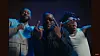 Adekunle Gold, Lojay and Shoday pose over a blue background in the video for 'Bobo.'