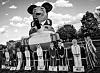 Black and white image of an inflatable caricature and several figures of people with the demand to release them.