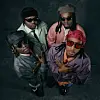The four members of Kenyan band Matata pose together in colorful jackets and sunglasses, looking up at the camera.