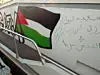 Gaza-bound boat with a painting of the Palestinian flag and some words written in Arabic.