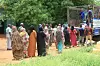 Sudanese who have recently returned from being displaced, queue to receive humanitarian aid in Ombada, west of Omdurman, on August 24, 2025.