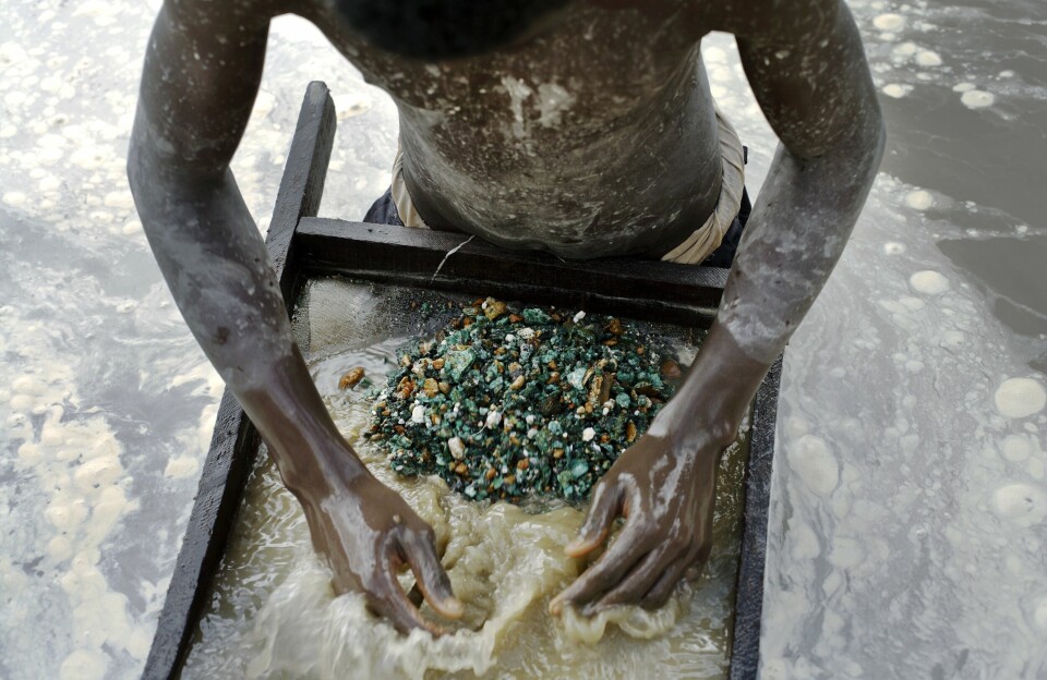 A young man looks for copper while standing in a pit. The DRC says it will permanently ban cobalt exporters who violate its new quota system. Cobalt is usually found as a byproduct of copper mining. A young man looks for copper while standing in a pit.