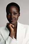 A portrait photo of Lupita Nyong’o in a white suit.