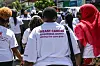 Back view of a demonstration of Kenyan women marching for Pink October or Breast Cancer Awareness Month.