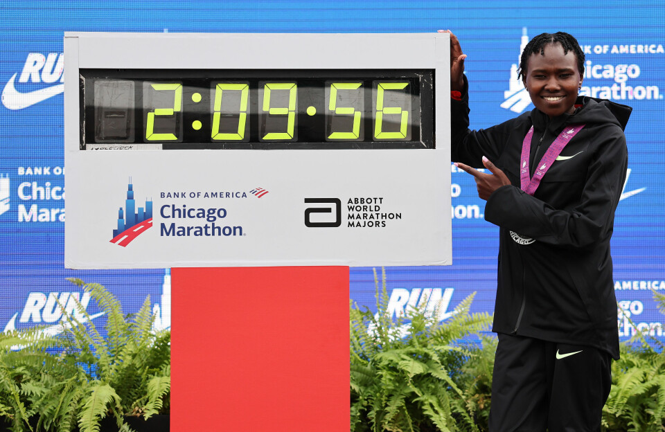 Kenyan marathon star Ruth Chepngetich has been banned from running professionally for three years for doping. However, the 2:09:56 world record she set at the Chicago Marathon last year stands. Ruth Chepngetich of Kenya smiles as she poses with a clock showing her world record time of 2:09:56