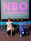 Nyasha Kadandara seated on stage (right) during a post-screening Q&A at the 2025 NBO Film Festival.