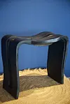 The picture of a black, shapely stool/table.
