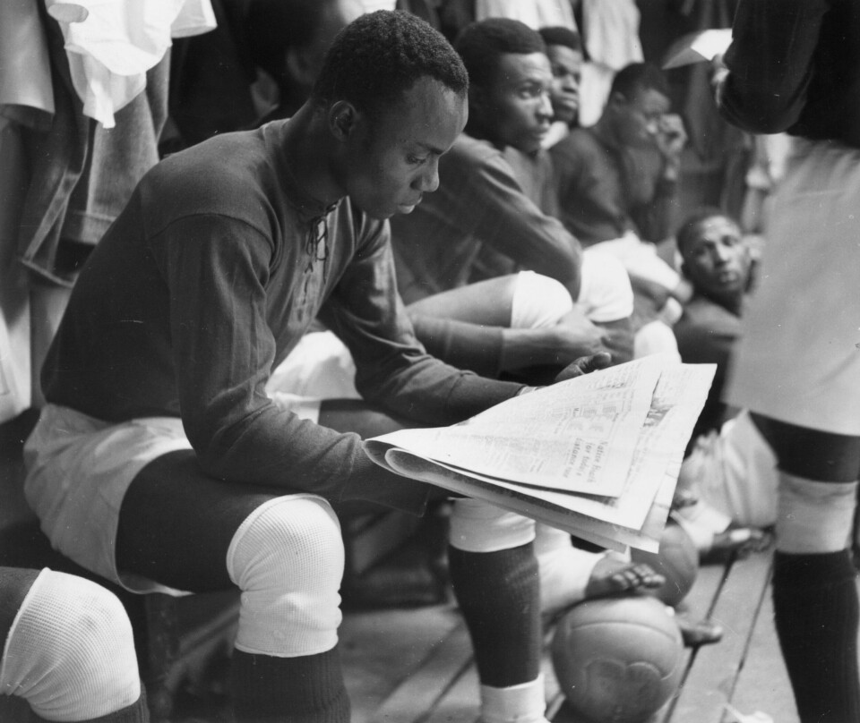 1949: Henshaw, the captain of a visiting Nigerian team reads the paper before a friendly game against Bishop Auckland. His team of fifteen Nigerian footballers are touring Britain on a good will mission and playing many teams around the country. Original Publication: Picture Post - 5047 - Nigerian Footballers - unpub. (Photo by Charles Hewitt/Picture Post/Hulton Archive/Getty Images) Henshaw, the captain of a visiting Nigerian team reads the paper before a friendly game against Bishop Auckland. His team of fifteen Nigerian footballers are touring Britain on a goodwill mission and playing many teams around the country.