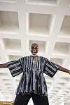 A still shot of Ghanaian musician Ata Kak wearing a traditional Ghanaian garb