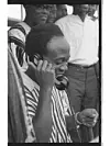President of Ghana, Dr Kwame Nkrumah, takes a call during the 10th anniversary celebration of the Convention People's Party (CPP) at the old Accra Sports Stadium in Accra.