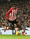 Noah Sadiki of Sunderland runs with the ball during the Premier League match between Manchester City and Sunderland at Etihad Stadium on December 6, 2025, in Manchester, United Kingdom.