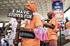 An anti-Female Genital Mutilation (FGM) protester holds a placard outside the National Assembly in Banjul on March 18, 2024, during the debate between lawmakers on a highly controversial bill seeking to lift the ban on FGM.
