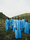 Kabusa Oriental Choir pictured in blue choir robes.