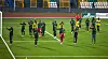 Nigeria’s women’s national football team, the Super Falcons, is on the field after a game, clapping hands.