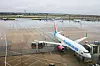 Airport ground staff attend to the South African low-cost airline FlySafair's Boeing 737-85P aircraft as it is parked on the tarmac at OR Tambo International Airport in South Africa.