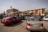 Vehicles queue for fuel at a fuel station in Abuja, Nigeria, on March 9, 2026, following a recent increase in petrol prices. Africa is feeling the impact of rising oil prices.